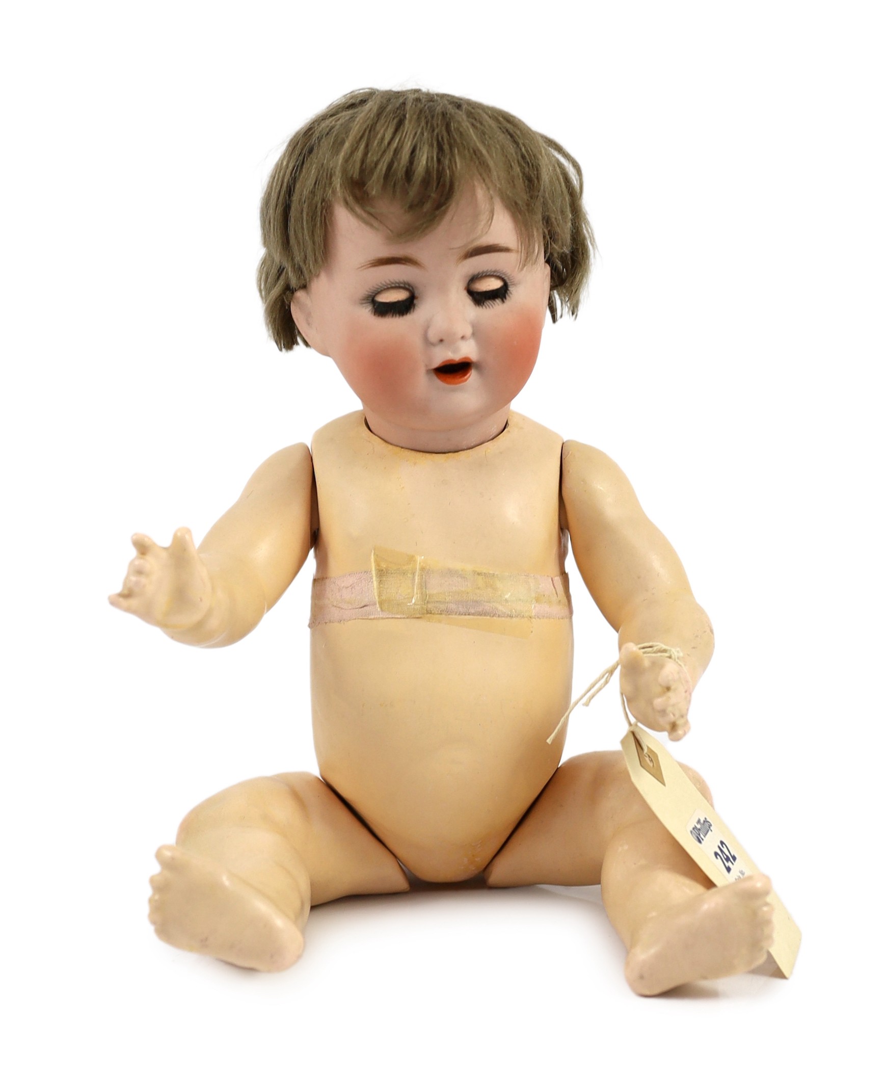 A Schutzmeister & Quendt bisque character doll, German, circa 1920, 14in.